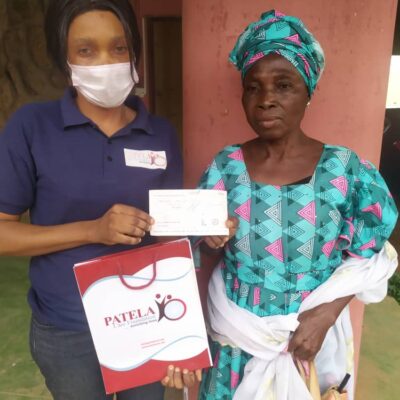 PCF Beneficiary receiving  some donation to help with her treatment .